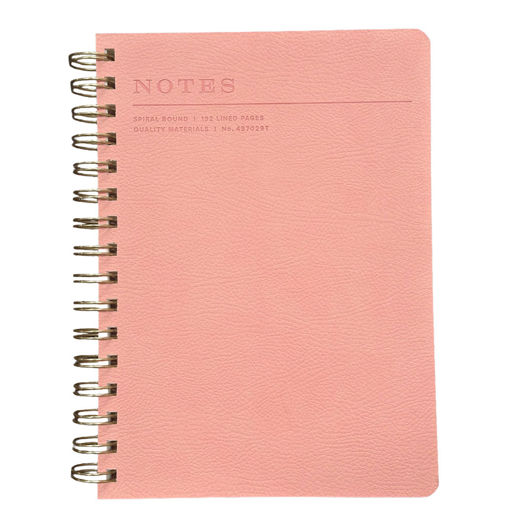 Fringe A5 pink notebook with spiral binding on a white background