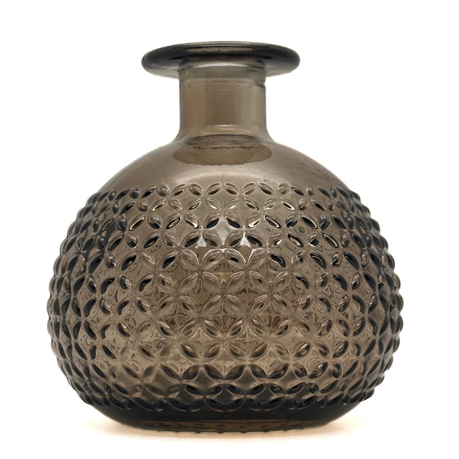A small bulb-shaped glass vase with a short neck and a textured, hobnail pattern on the rounded body, shown on a plain white background.