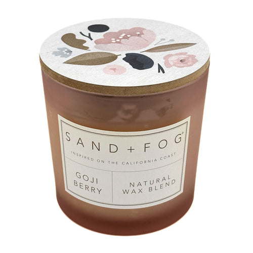 Goji Berry candle with floral lid and 'Sand + Fog' label on a white background