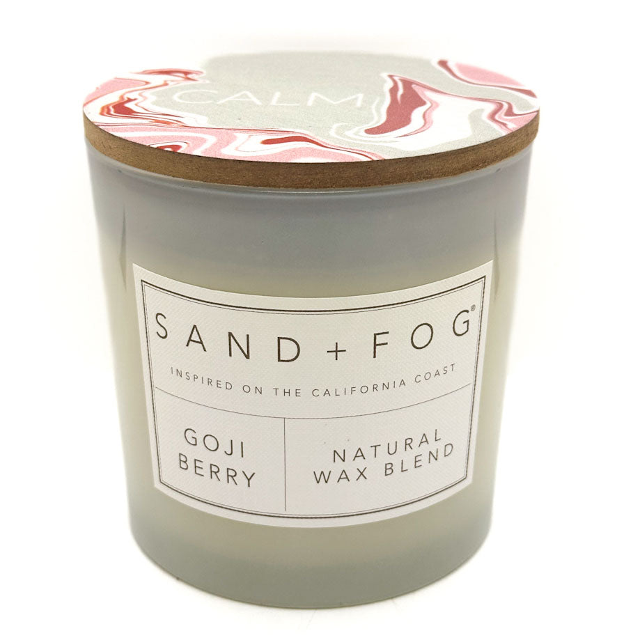 Goji Berry candle with wood lid and SAND + FOG label on a white background