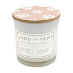 Golden Nutmeg Candle with a paw print lid labeled 'Sand + Paws' on a white background