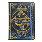 A hardcover notebook featuring an Art Deco style cover design inspired by 'The Great Gatsby', with a blue elastic closure band, shown on a plain white background.
