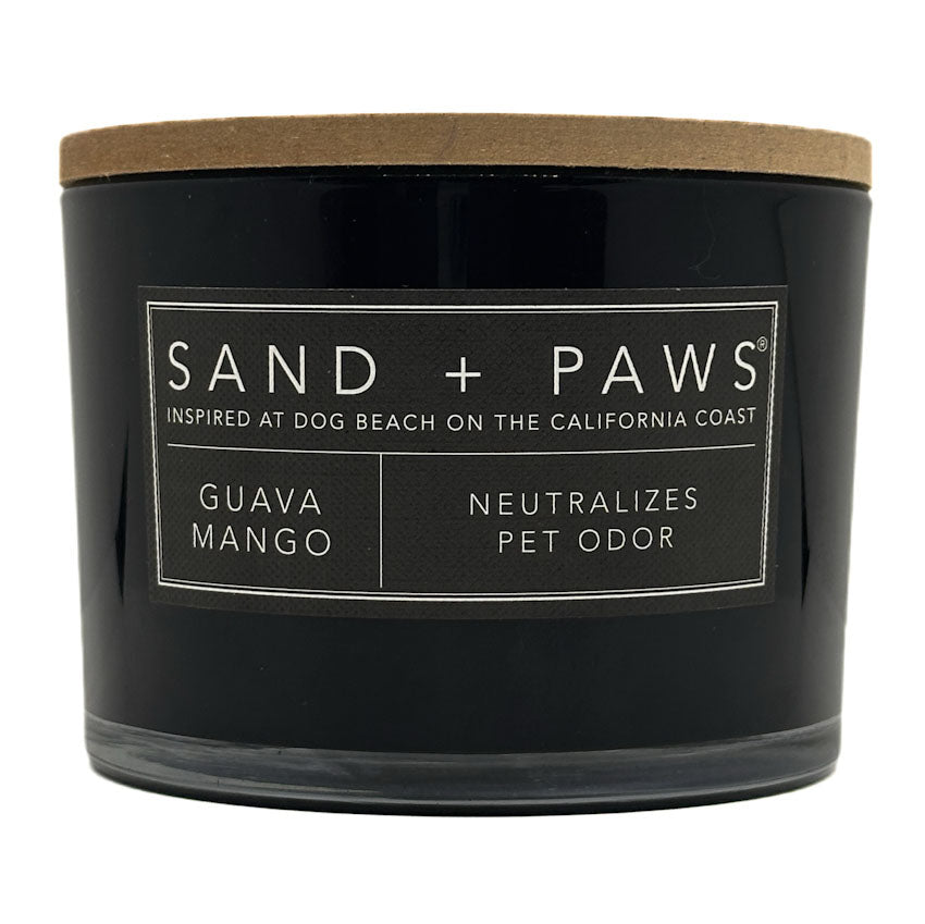 Guava Mango Black candle with 'Sand + Paws' label on a white background