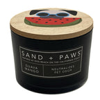 Guava Mango Black candle with a wooden lid featuring a dog and watermelon design, labeled 'Sand + Paws'.