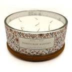 Candle with floral label on a white background