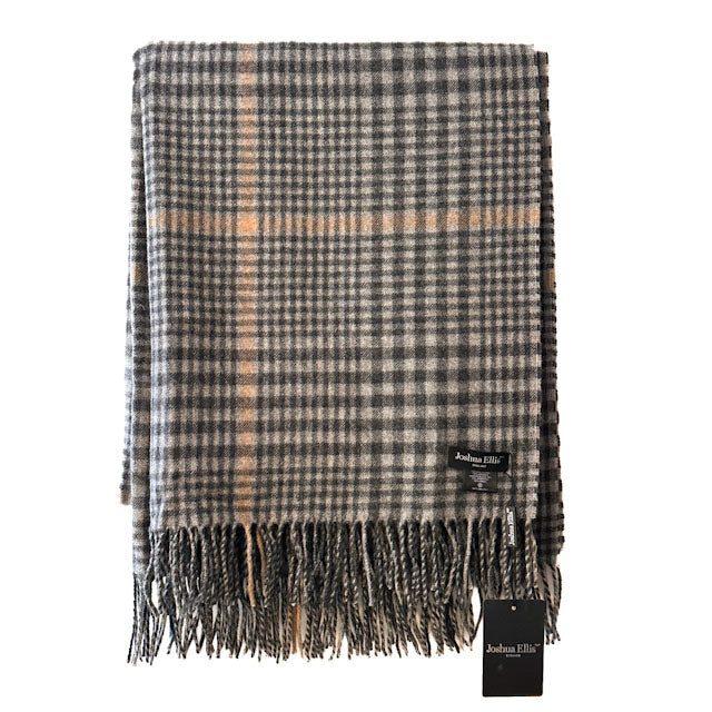 A folded plaid scarf with fringe, featuring a grey, black, and beige check pattern with a tan check stripe. A black fabric brand tag reading 'Joshua Ellis London' is attached near the bottom right corner.