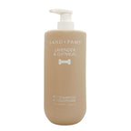 Beige bottle of Sand + Paws Lavender & Oatmeal pet shampoo and conditioner on a white background