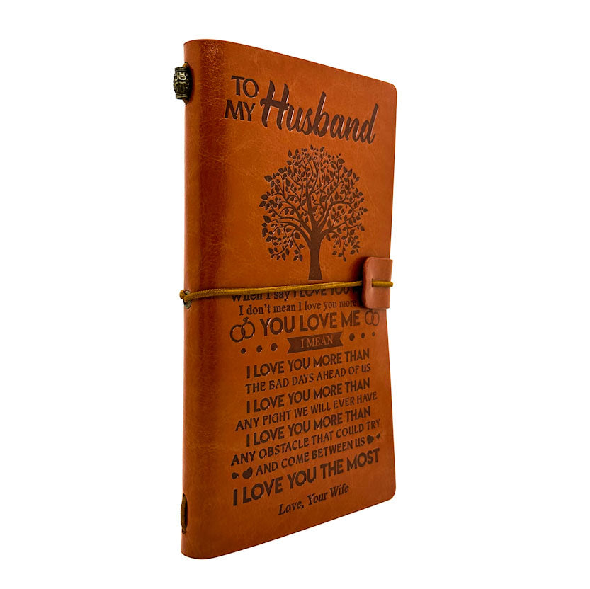 Brown leather journal with engraved text and tree design, titled 'To My Husband'.