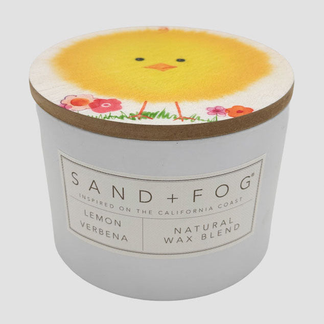 Lemon Verbena candle with a chick design on the lid and 'Sand + Fog' branding.