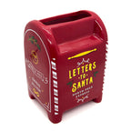 Red mailbox-shaped candle container with 'Letters to Santa' text on a white background