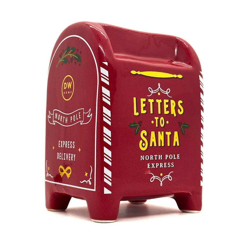 Red mailbox-shaped candle container with 'Letters to Santa' text on a white background