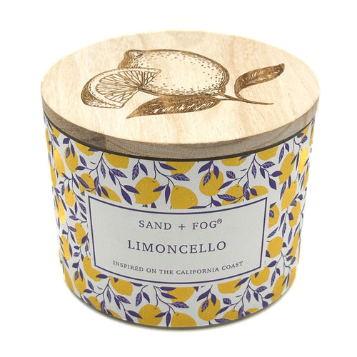SAND + FOG Limoncello Candle with wooden lid featuring lemon design and 'Sand + Fog' branding.