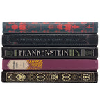 A stack of five decorative book spines on a plain white background, including titles such as Frankenstein and A Midsummer Night's Dream.
