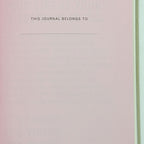 Journal cover with 'This Journal Belongs To' text on a pink and green gradient background