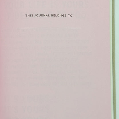Journal cover with 'This Journal Belongs To' text on a pink and green gradient background