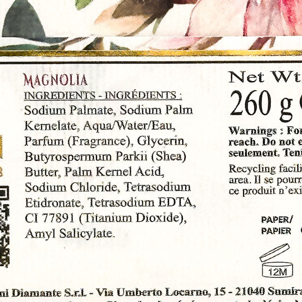 Product label with ingredients and branding details, featuring floral design at the top.