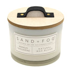 Mango Tangerine candle with wooden lid and Sand + Fog label on a white background