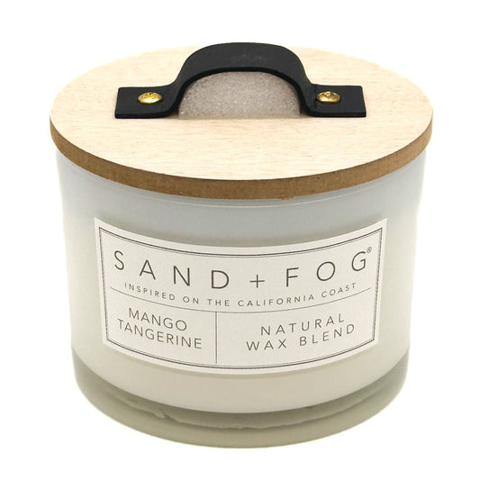 Mango Tangerine candle with wooden lid and Sand + Fog label on a white background