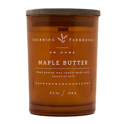 An amber glass jar candle with a dark gray lid, labeled 'Charming Farmhouse DW Home Maple Butter' on a white background.