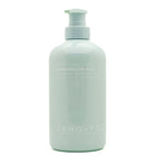 SAND + FOG Light blue bottle of Marshmallow Skies scented hand soap on a white background