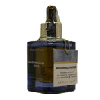 Perfume oil bottle labeled 'Marshmallow Skies' by Sand + Fog on a white background