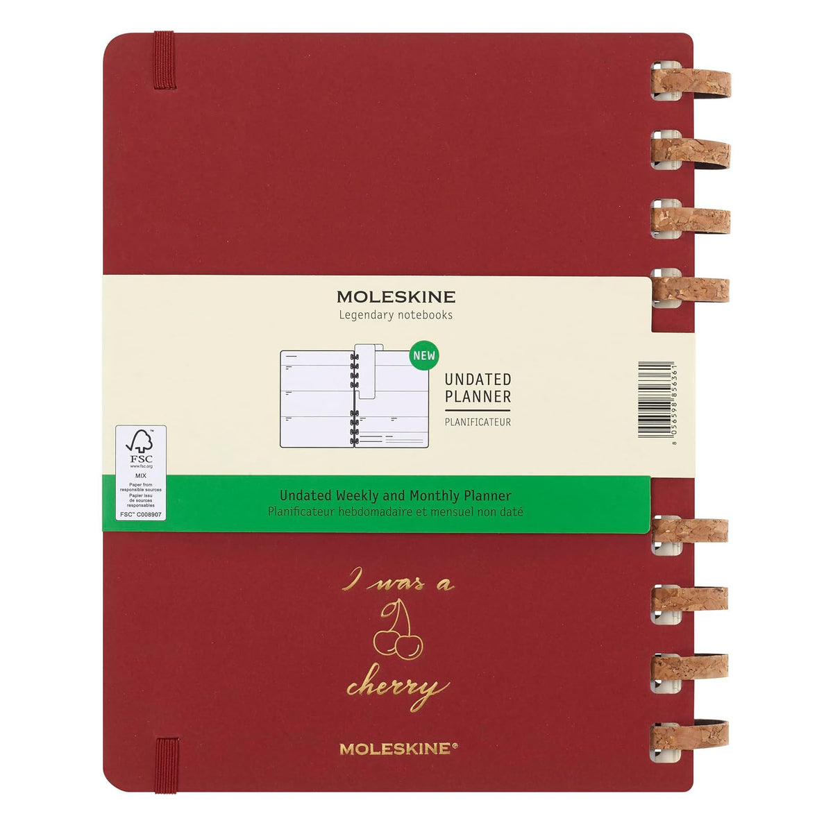 Moleskine planner with red cover and beige label on a white background