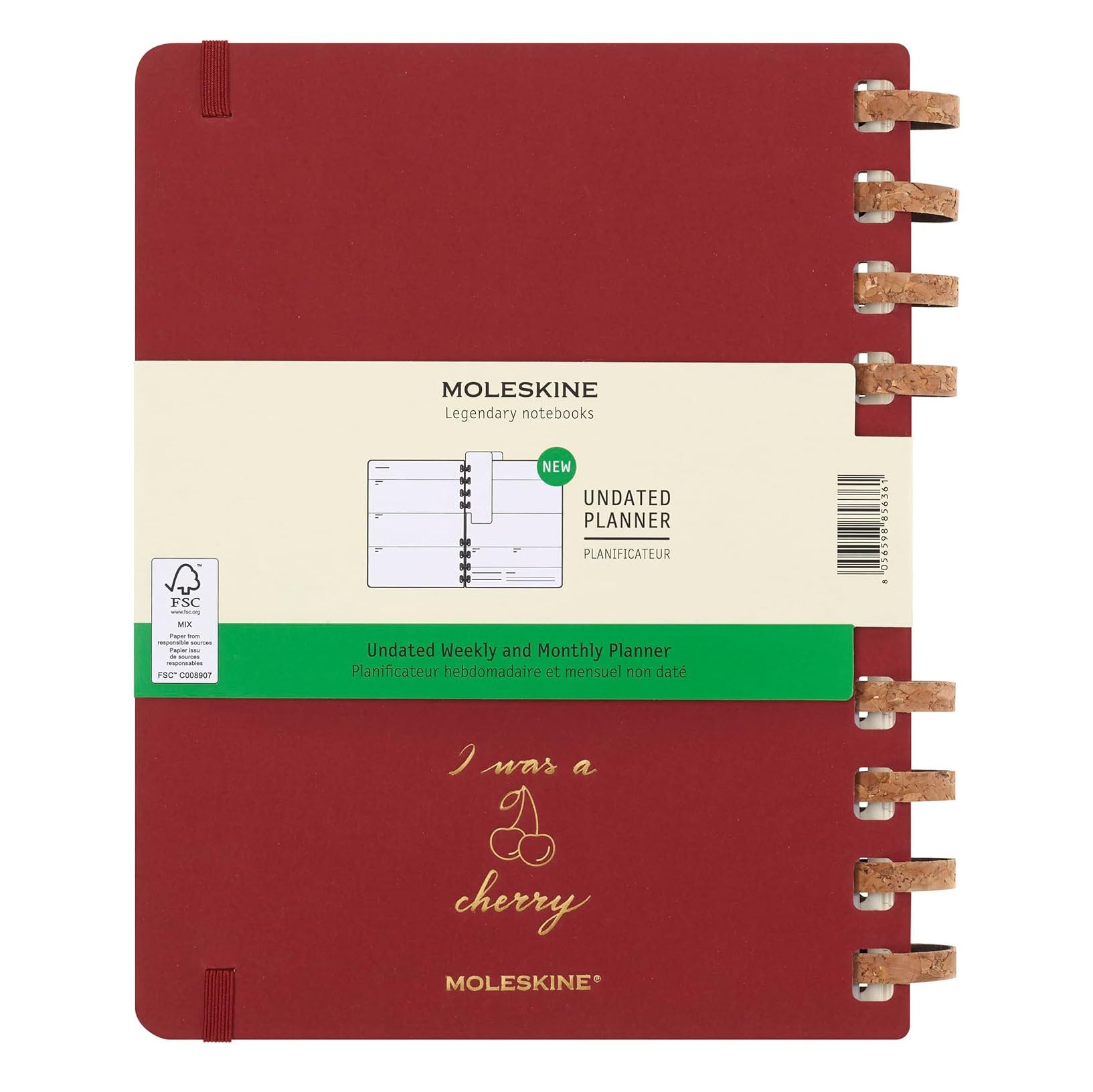 Moleskine planner with red cover and beige label on a white background