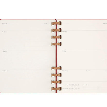 Open planner with weekly layout on white background