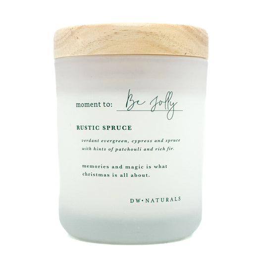 Moment to be Jolly candle by DW Home with wooden lid and text on a white background