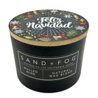 Mulled Wine black candle with 'Feliz Navidad' lid featuring holiday designs, branded as Sand + Fog.