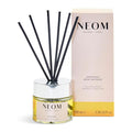 Neom Happiness Reed Diffuser with packaging on a white background