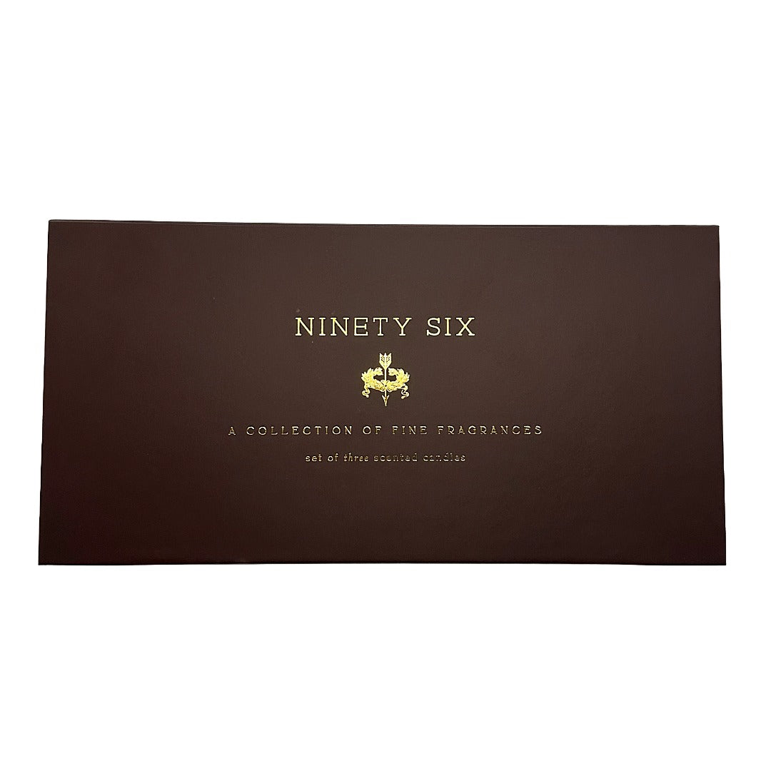 A rectangular dark brown box with gold foil text reading 'NINETY SIX' and smaller text below, photographed on a plain white background.