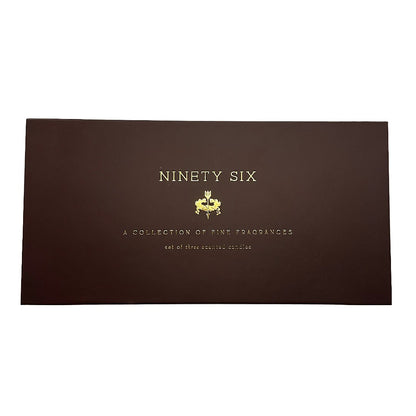 A rectangular dark brown box with gold foil text reading 'NINETY SIX' and smaller text below, photographed on a plain white background.