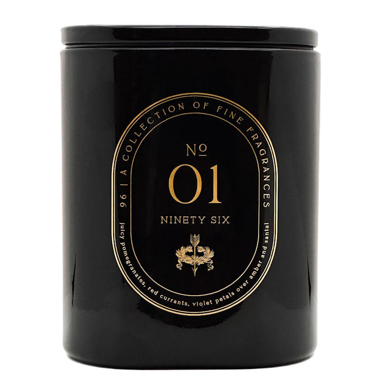 A black cylindrical scented candle jar with a glossy finish, featuring a gold circular label that reads 'No 01 Ninety Six' and 'A Collection of Fine Fragrances'.