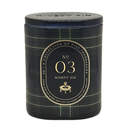 A cylindrical scented candle with a black and navy plaid pattern and gold lettering. The front label reads 'No 03 Ninety Six' and features a gold crest, with 'NINETY SIX' embossed on the lid.