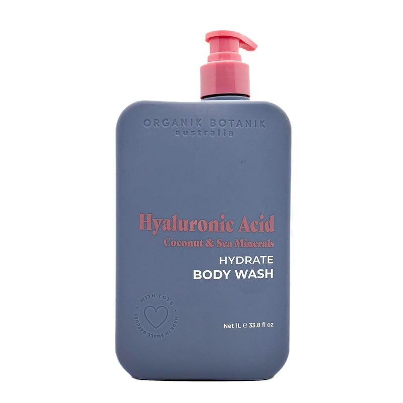 Blue bottle of Organik Botanik Hyaluronic Acid body wash with pink pump on a white background