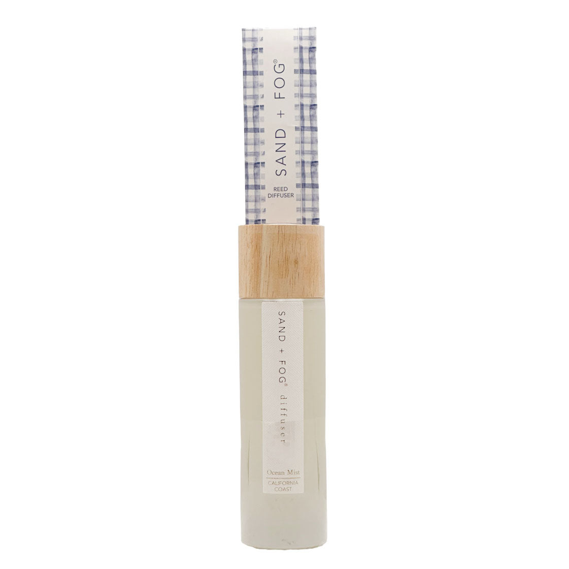 SAND + FOG Ocean Mist Reed Diffuser in nude bottle with checkered reed pack on a white background