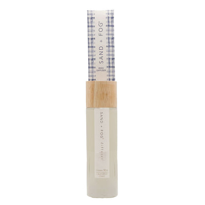 SAND + FOG Ocean Mist Reed Diffuser in nude bottle with checkered reed pack on a white background