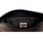 Close-up of a brown leather bag with a brand label on a white background