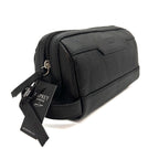 Black leather wash bag with a visible brand tag on a white background