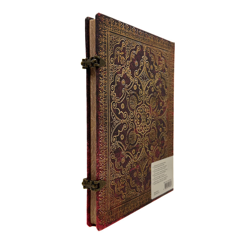 Decorative Carmine Equinoxe notebook with intricate patterns on a white background