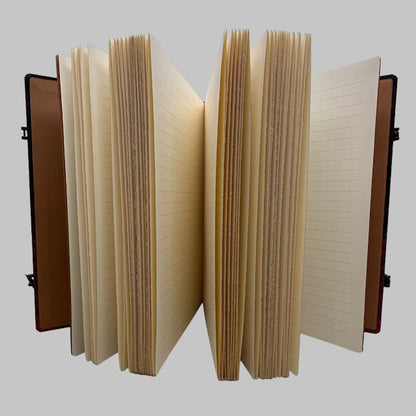 Open notebook with lined pages on a gray background
