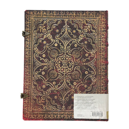 Decorative notebook with intricate gold patterns on a white background