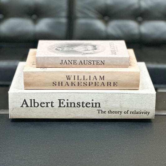 Stack of keepsakes with titles on a table