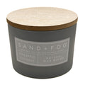 Pineapple Coconut Grey candle with wooden lid and 'Sand + Fog' label on a white background