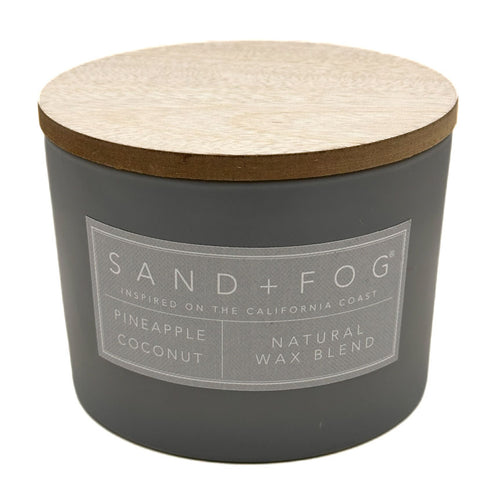 Pineapple Coconut Grey candle with wooden lid and 'Sand + Fog' label on a white background