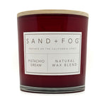 Pistachio Dream candle with a label reading 'Sand + Fog' on a white background