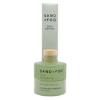 Sand + Fog Pistachio Dream reed diffuser with green bottle and wooden cap on a white background