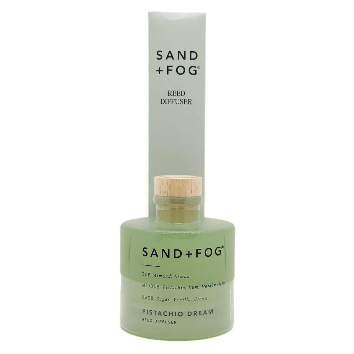 Sand + Fog Pistachio Dream reed diffuser with green bottle and wooden cap on a white background