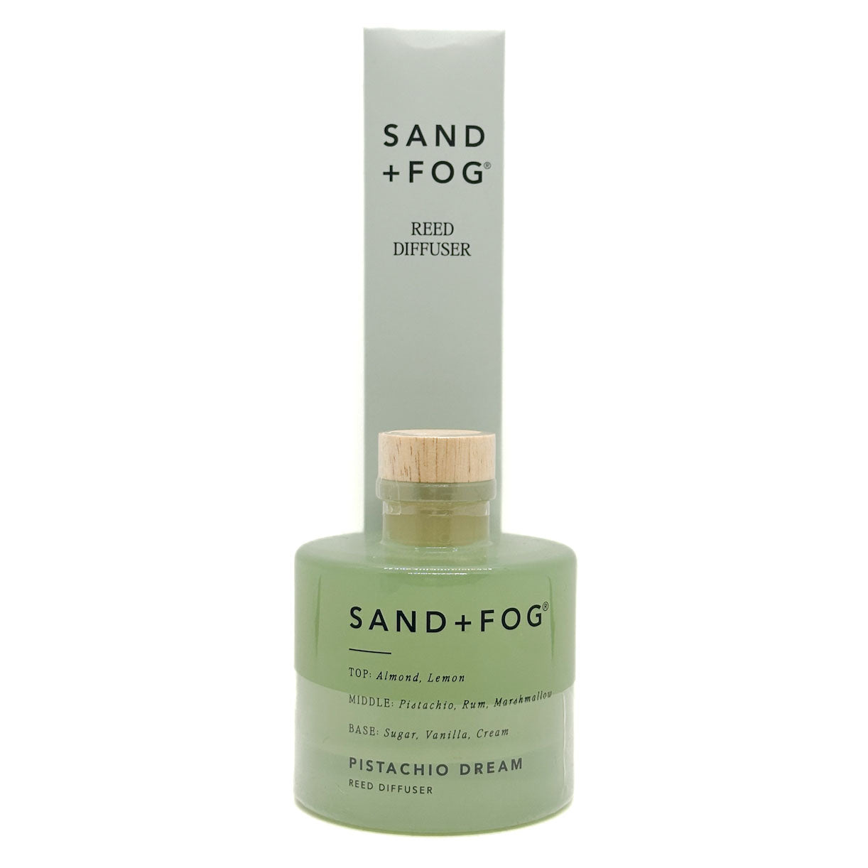 Sand + Fog Pistachio Dream reed diffuser with green bottle and wooden cap on a white background